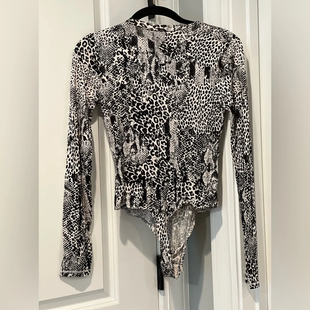 🏷️ Intimately Free People Gotcha Bodysuit Size Small in Snake Print